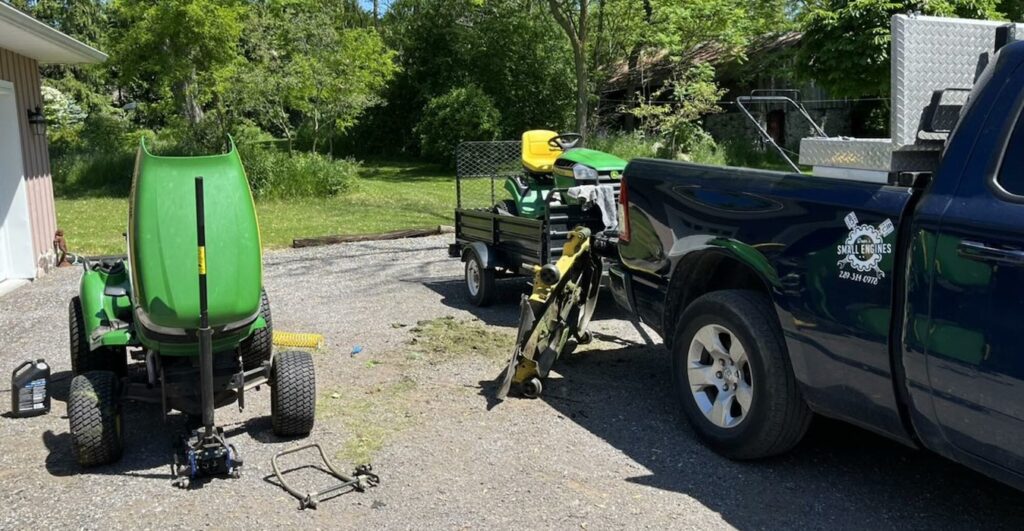 Lawn tractor's engines being serviced